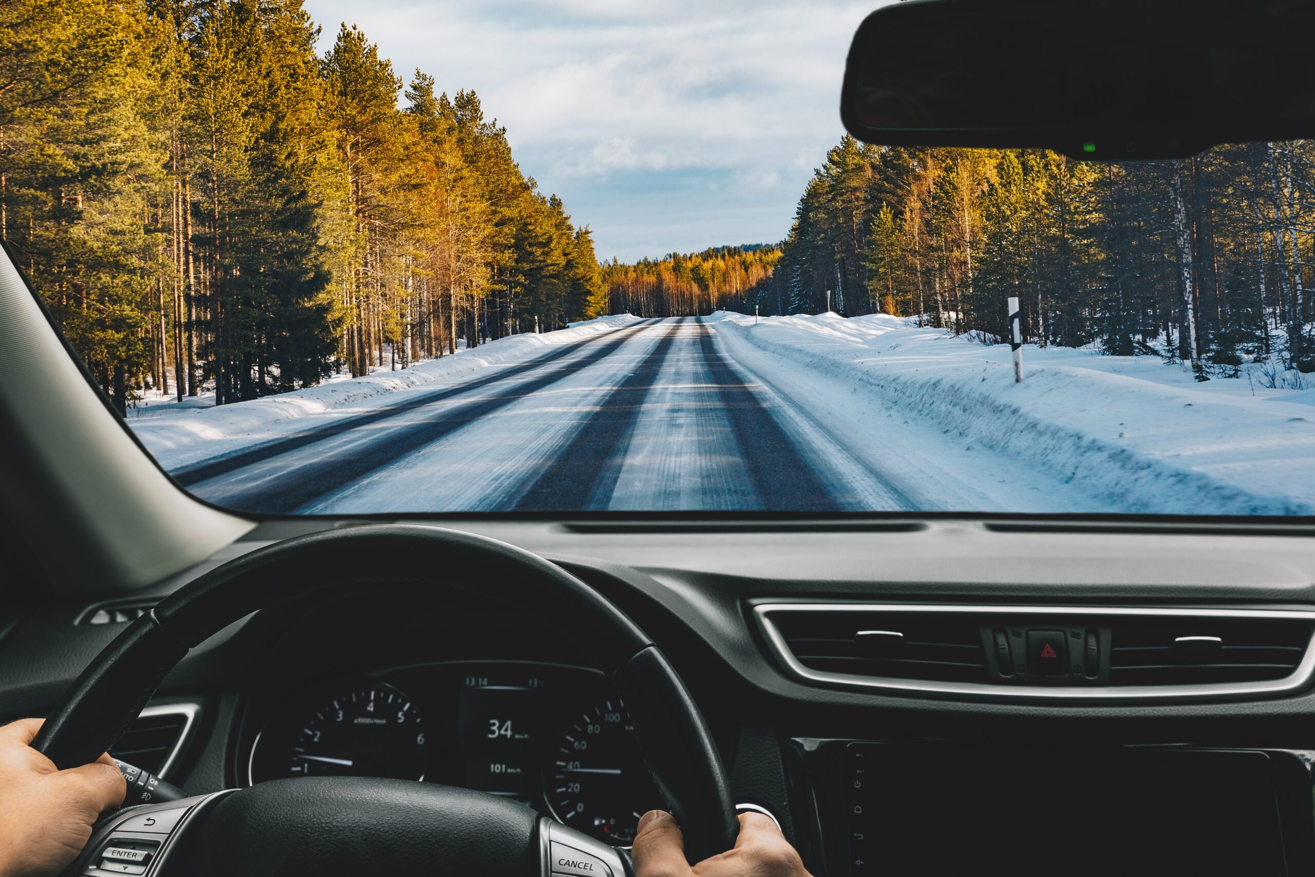 Man,Driving,Car,On,Frozen,Snow,Country,Road,In,Winter